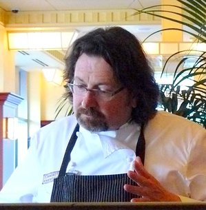 Chef Brennan in dining room.JPG